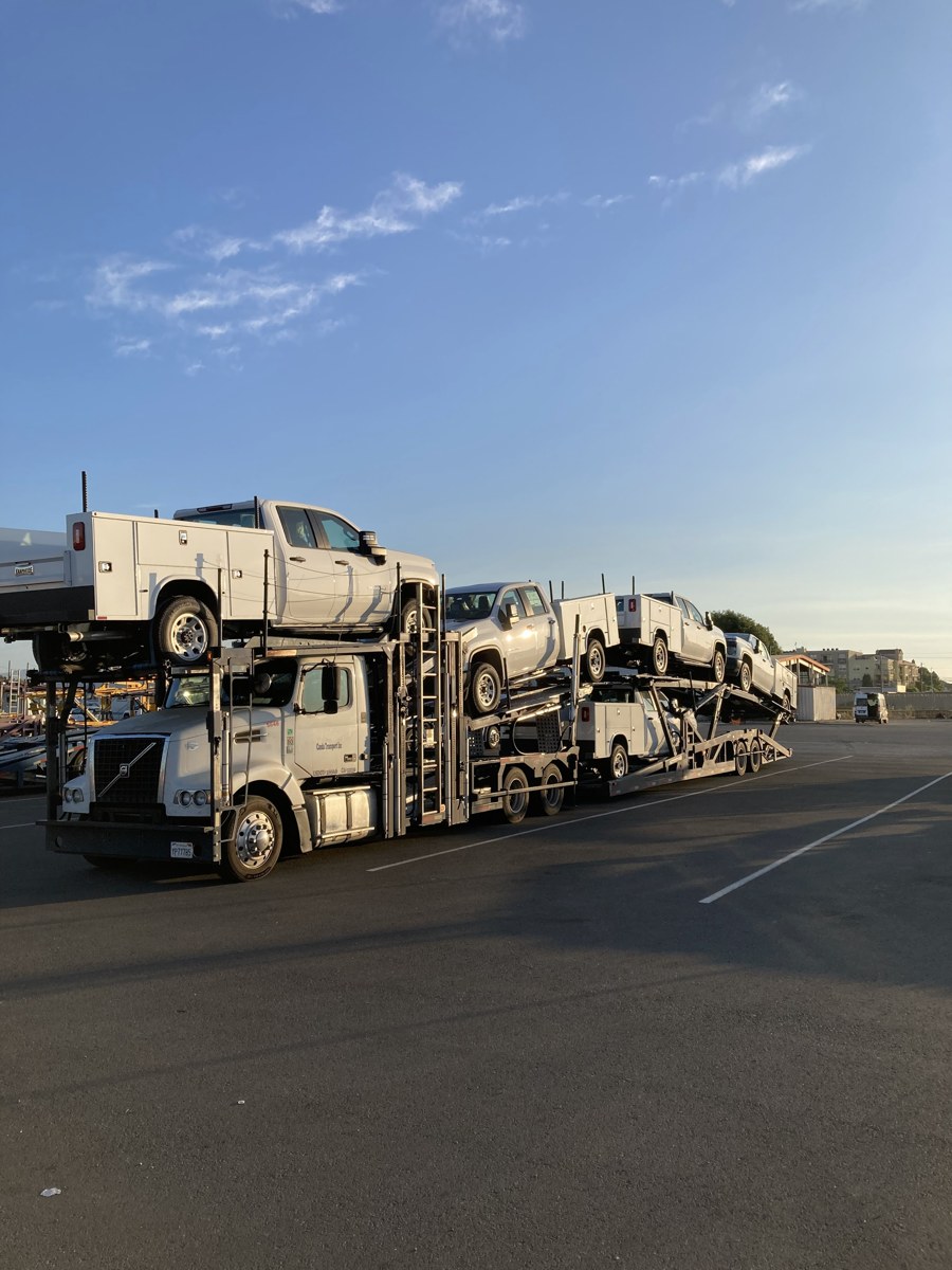 Canda Transport full load of work trucks